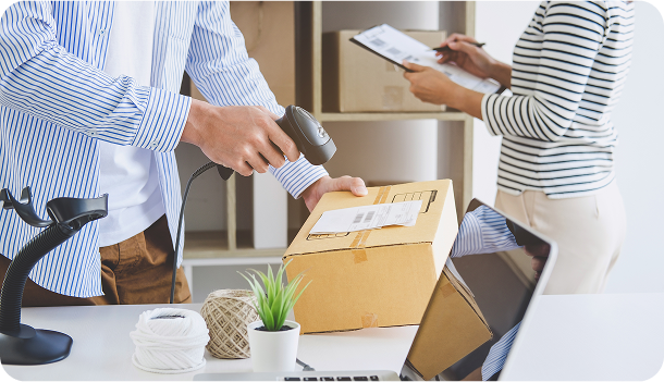 Scanning package with barcode scanner, clipboard nearby.